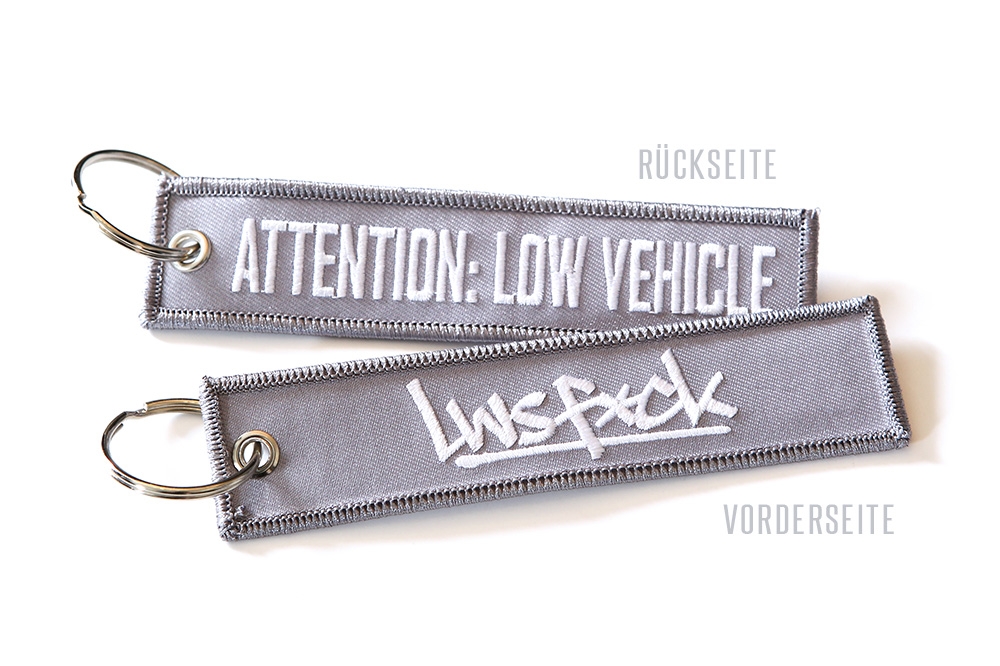 Attention Low Vehicle Keychain Grey